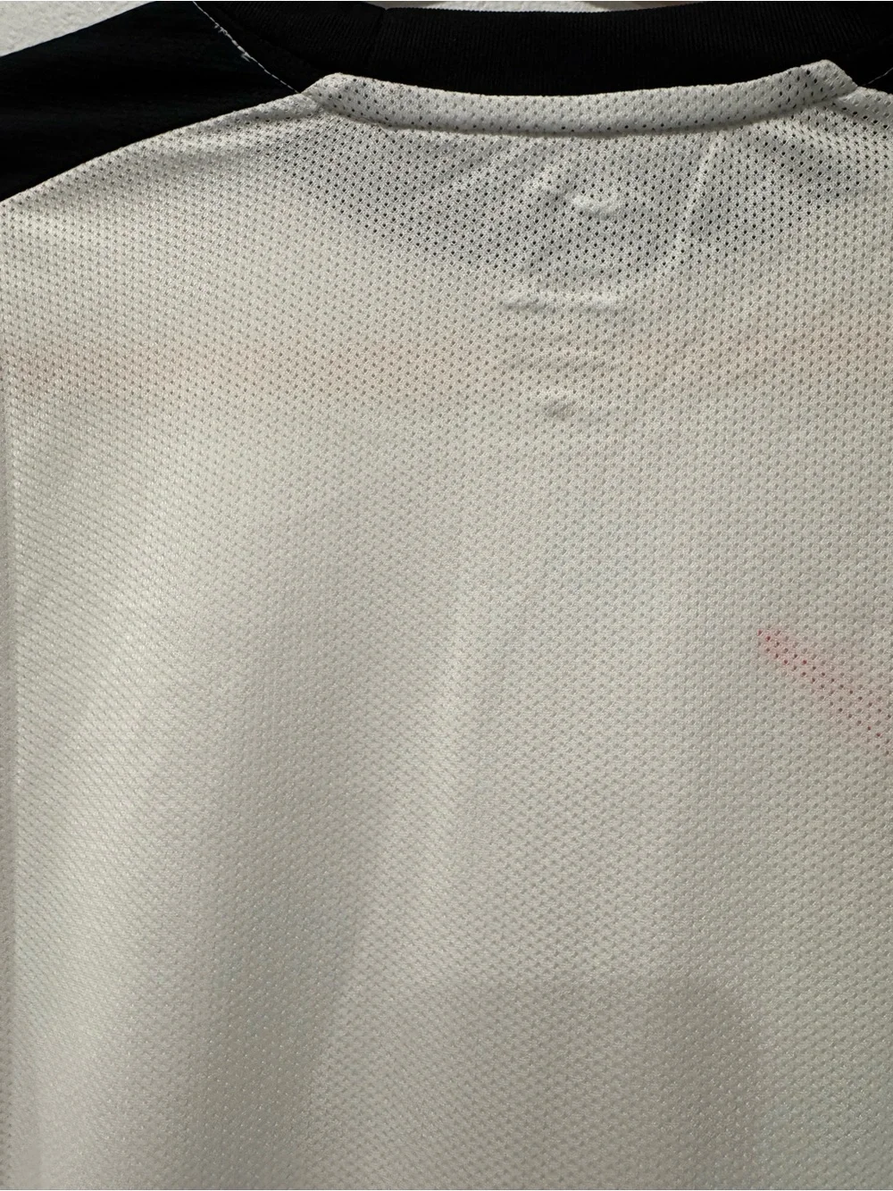 Nike Men’s White Short-Sleeve Training Shirt with Black Trim and Red Swoosh